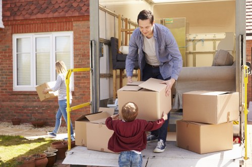Removal team loading boxes and furniture for a Croydon home move