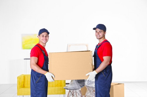 Delivery crew handling furniture during a property move