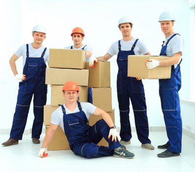 Removal team preparing safely with protective equipment during a move