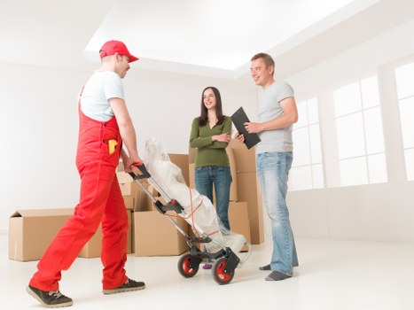 Professional team handling office furniture during a Croydon relocation