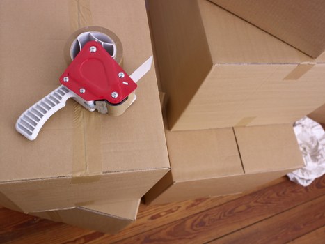 Professional movers handling furniture in a Croydon flat or family home